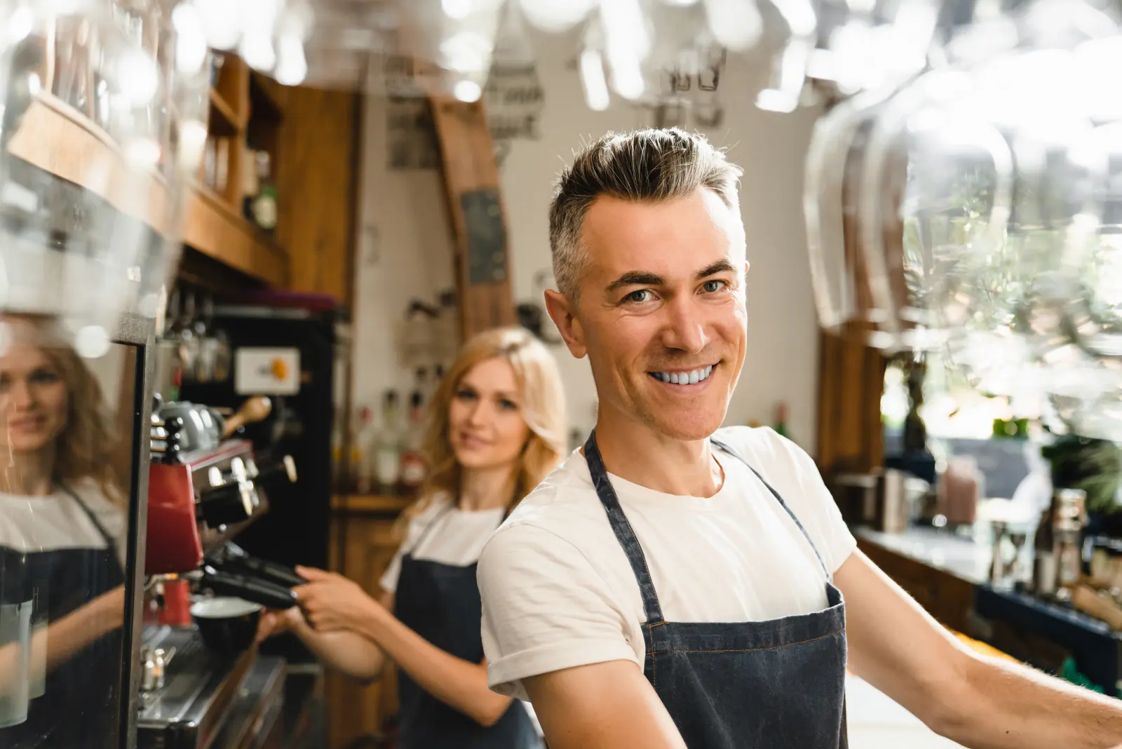 Waiters working the coffee machine during service