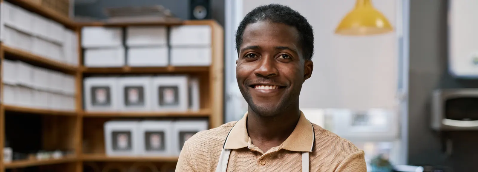 Bakery worker smiling behind the counter